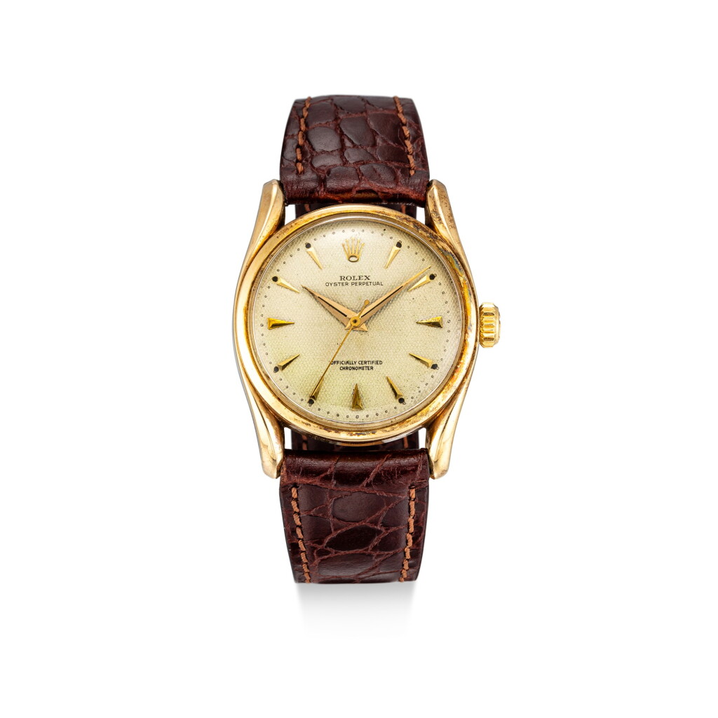 View full screen - View 1 of Lot 858. ROLEX | BOMBAY, REFERENCE 6102 A YELLOW GOLD WRISTWATCH, CIRCA 1953.