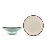 A moulded white-glazed 'twin fish' dish, Jin dynasty, and a Qingbai zhadou, Northern Song dynasty | 金 白釉印雙魚紋盤 及 北宋 青白釉渣斗一組兩件