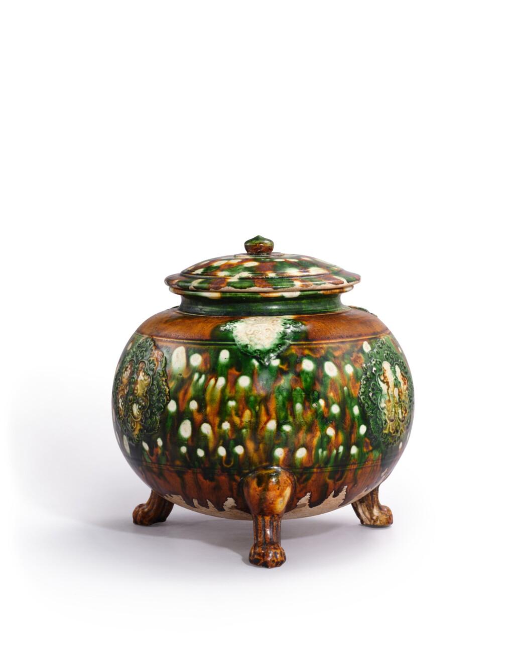 View full screen - View 1 of Lot 5115. A sancai-glazed appliqué-decorated tripod vessel and cover, Tang dynasty | 唐 三彩貼寶相花三獸足蓋爐.