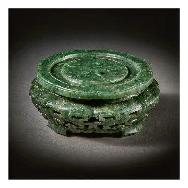 View full screen - View 1 of Lot 233. A RARE IMPERIAL SPINACH-GREEN JADE STAND, QING DYNASTY, QIANLONG PERIOD.