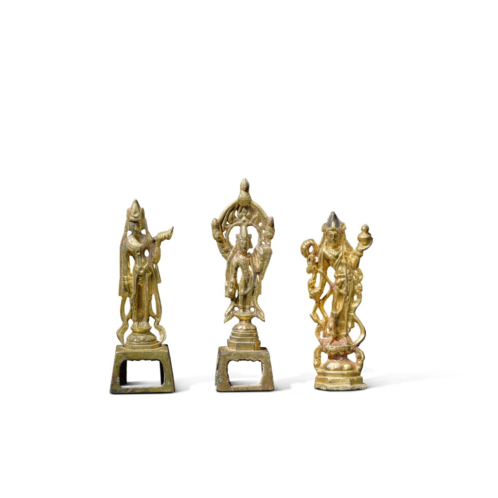 View full screen - View 1 of Lot 120. A group of three small gilt-bronze standing figures of bodhisattvas, Tang dynasty.