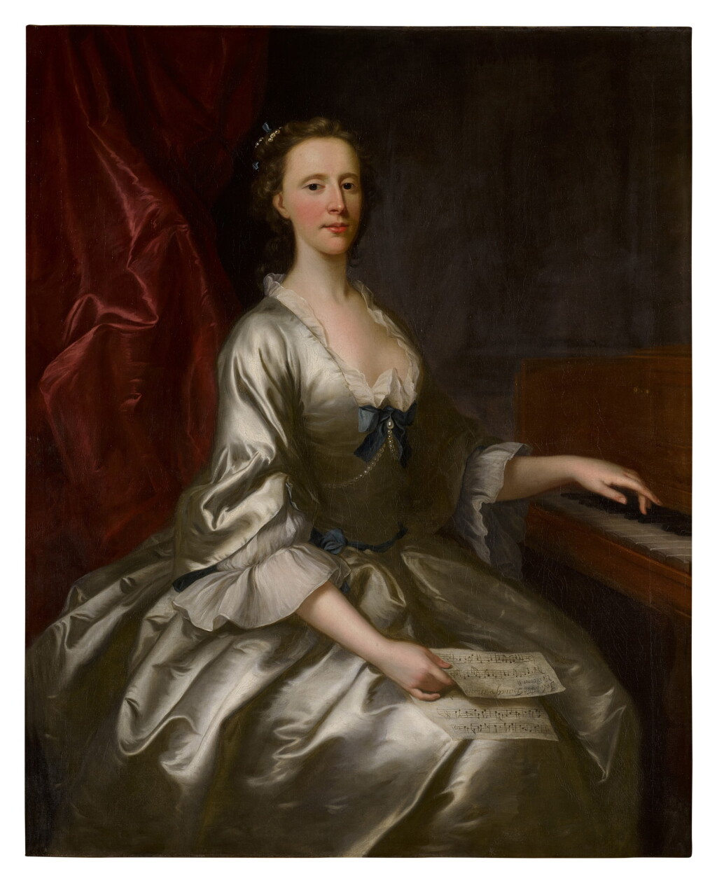 View full screen - View 1 of Lot 228. Portrait of a lady, three-quarter length, seated at a harpsichord, holding a sheet of music.