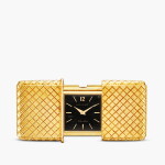 A yellow gold purse watch with black dial and sliding covers, Circa 1955