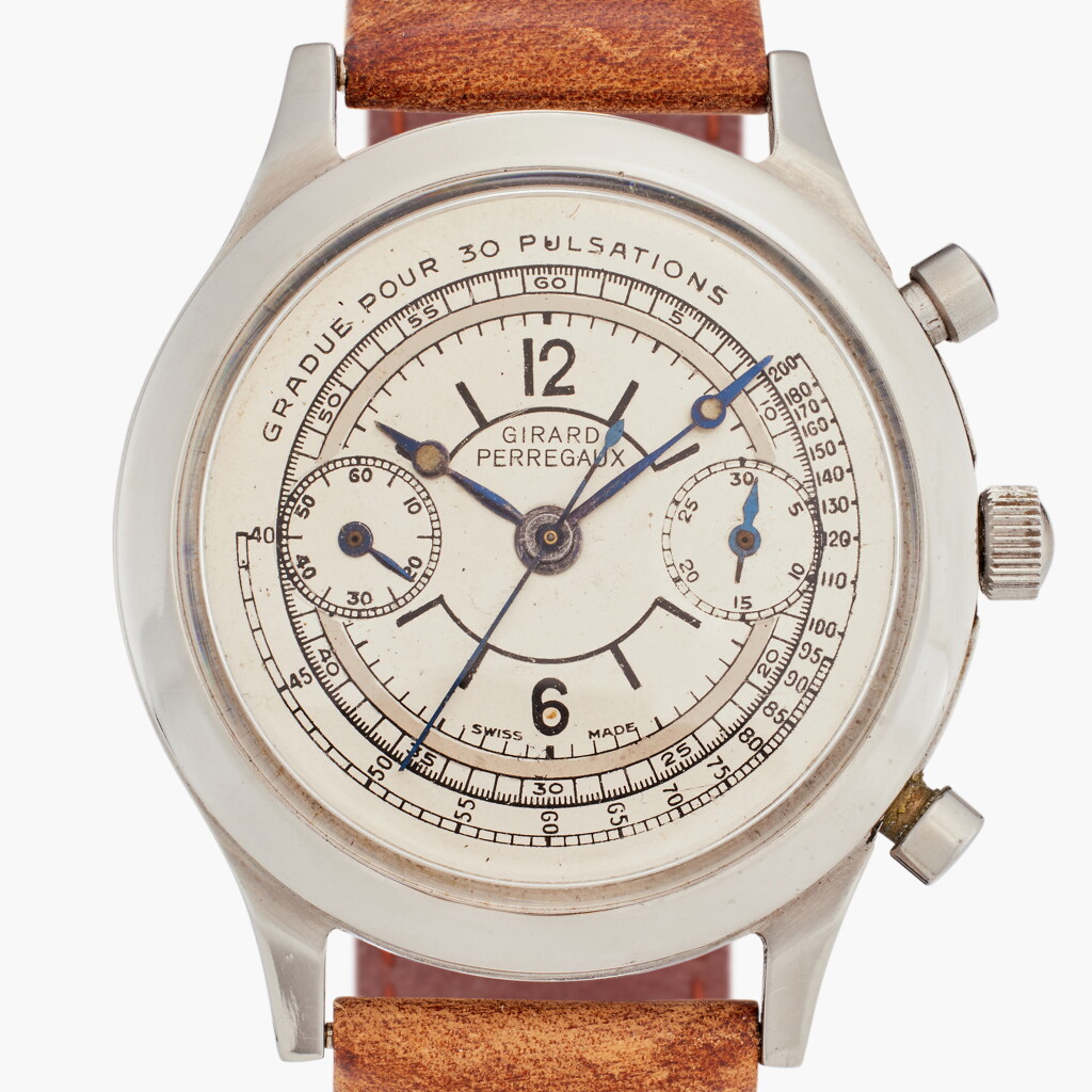 View full screen - View 1 of Lot 603. Reference 8432 | A stainless steel chronograph wristwatch with two-tone dial, Circa 1960.