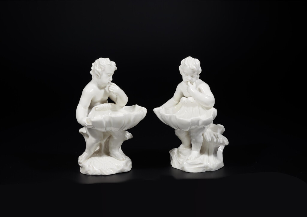 View full screen - View 1 of Lot 143. A rare pair of Dutch white porcelain figural salts, Weesper Porseleinfabriek, Weesp, between 1759-1771 | Rare paire de salières aux putti en porcelaine de la manufacture de Weesp, entre 1759-1771.