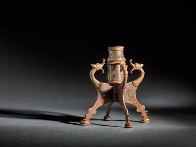 View full screen - View 1 of Lot 108. A gold and silver-inlaid bronze portable candlestick, probably Mosul, Mesopotamia, 13th century.