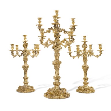 View full screen - View 1 of Lot 19. A Victorian silver-gilt suite of candelabra, R&S Garrard & Co., London, 1848 (the pair) and 1861 (the larger).