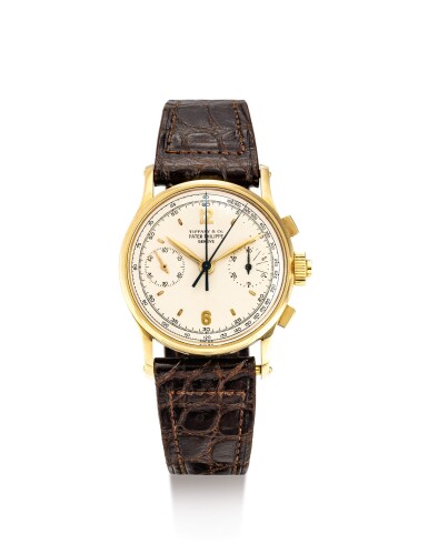 View full screen - View 1 of Lot 2100. PATEK PHILIPPE | REFERENCE 1436, A HIGHLY EXCEPTIONAL AND POSSIBLY UNIQUE YELLOW GOLD SPLIT SECONDS CHRONOGRAPH WRISTWATCH WITH ORIGINAL BOX, RETAILED BY TIFFANY & CO., MADE IN 1960 AND SOLD IN 1961 | 百達翡麗 | "型號1436 非常精美及獨特黃金追針計時腕錶,備有原裝盒子,由蒂芙尼發行,1960年製及1961年售".