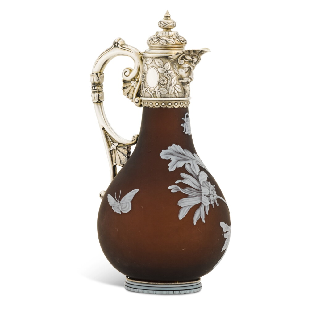 View full screen - View 1 of Lot 77. A Victorian silver-gilt mounted cameo glass claret jug, the Army & Navy Co-operative Society Ltd., London, 1884.