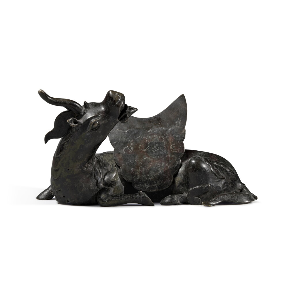 View full screen - View 1 of Lot 695. A bronze mirror stand, Ming dynasty | 明 銅犀牛望月鏡座.