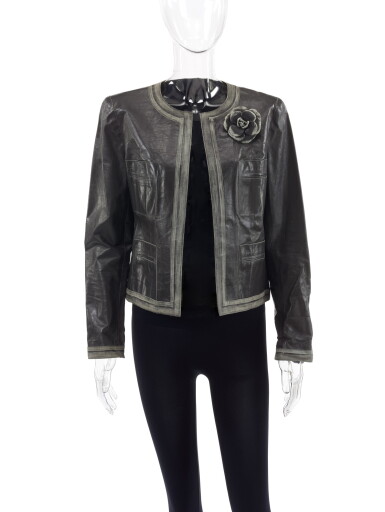 View full screen - View 1 of Lot 87. CHANEL | GREY LEATHER JACKET WITH CAMELLIA BROOCH .