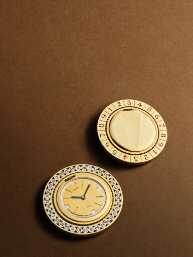 View full screen - View 1 of Lot 2253. New York retailed | A yellow gold watch in the form of a double-sided roulette wheel, Circa 1938 .