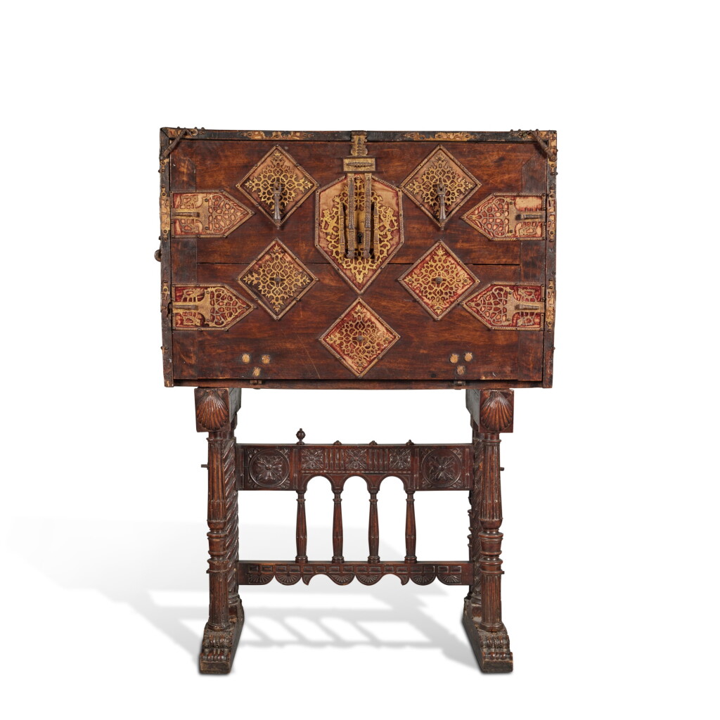 View full screen - View 1 of Lot 609. A Spanish Baroque Gilt Metal and Iron Mounted Parcel Gilt and Bone Inlaid Walnut Vargueño on Stand, 17th Century.