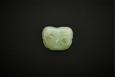View full screen - View 1 of Lot 3776. A yellowish-celadon jade 'human face' ornament, Inner Mongolia, Neolithic period, 3rd - 2nd millennium BC | 新石器時代 公元前三或二世紀 內蒙古青黄玉圓方形人面飾.