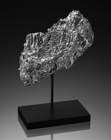 View full screen - View 1 of Lot 99. Dronino Meteorite | Flange With Naturally Formed Hole.