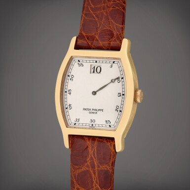 View full screen - View 1 of Lot 359. Reference 3969 Jump Hour | A limited edition pink gold tonneau shaped jump hour wristwatch with date, Circa 1989.