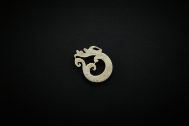 View full screen - View 1 of Lot 3828. A calcified greyish- green jade 'coiled dragon' ornament, Eastern Han dynasty | 東漢 雞骨白青灰玉蜷體龍珮.