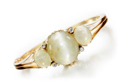 View full screen - View 1 of Lot 59. CAT'S EYE CHRYSOBERYL AND DIAMOND BANGLE, LATE 19TH CENTURY.