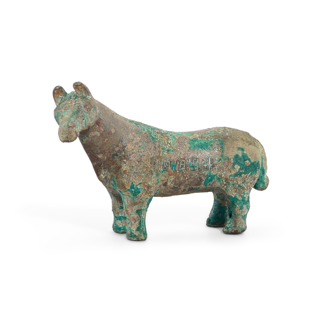 View full screen - View 1 of Lot 3024. A small inscribed bronze tapir, Eastern Zhou dynasty, Warring States period 東周戰國 青銅銘文貘.