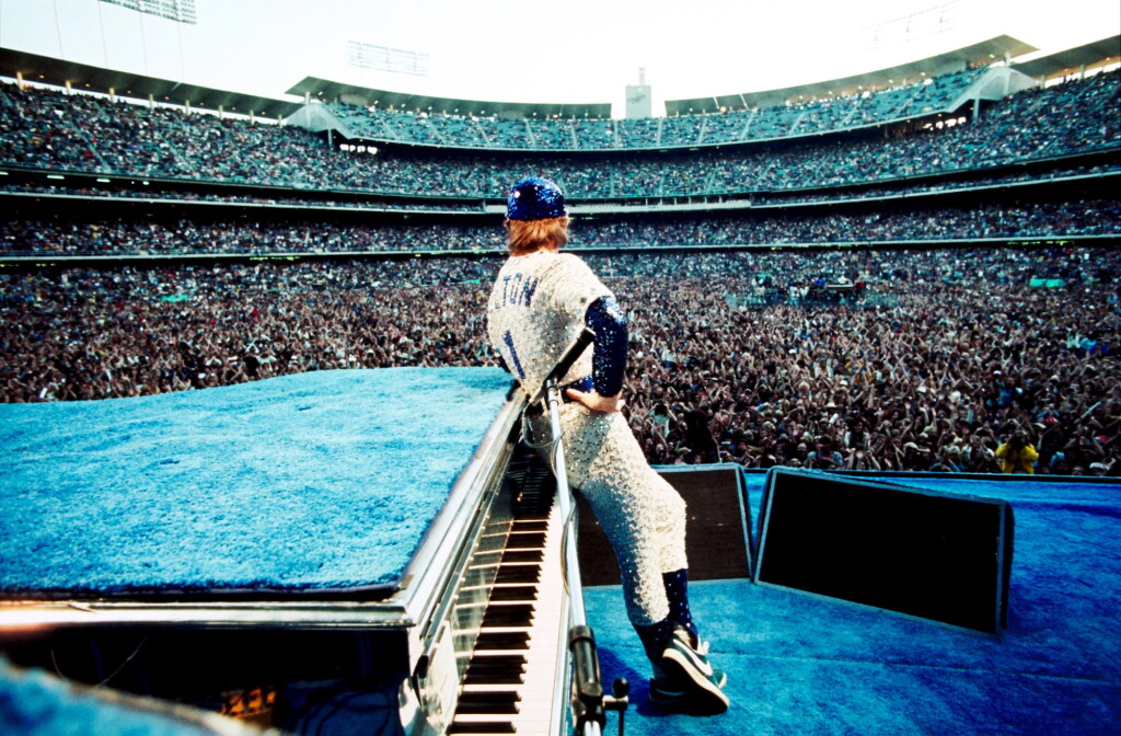 View full screen - View 1 of Lot 39. TERRY O'NEILL | ELTON JOHN, DODGER STADIUM, 1975.