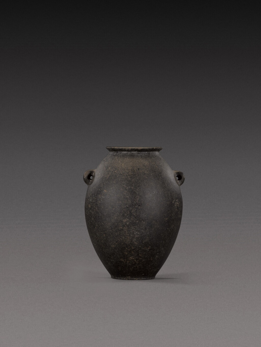 Voir en plein écran - Voir 1 du lot 113. An Egyptian Basalt or Graywacke Jar, Predynastic Period (Naqada II)/1st Dynasty, circa 3500-2900 B.C..
