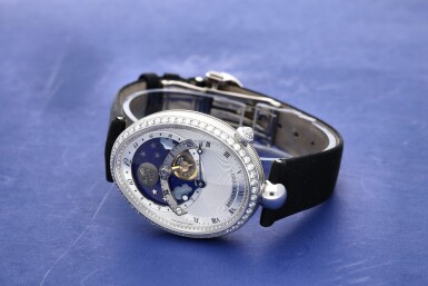 View full screen - View 1 of Lot 107. Reference 8998 Reine De Naples A white gold and diamond-set automatic oval wristwatch with moon phases and 24-hour indication, Circa 2015.