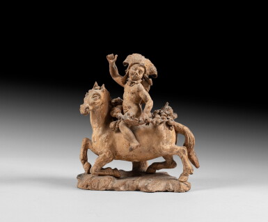 View full screen - View 1 of Lot 52. Child in an exotic costume riding a horse and holding a flower garland | Enfant à cheval dans un costume exotique tenant une guirlande de fleurs.