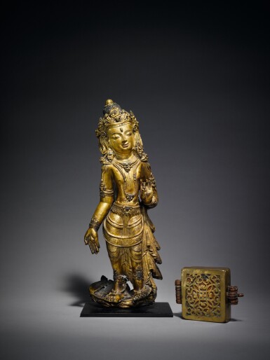 View full screen - View 1 of Lot 331. A Gilt Copper Repoussé Figure of a Bodhisattva and a Copper Alloy Ga’u with Copper Inlay, Tibet, circa 15th Century and later.
