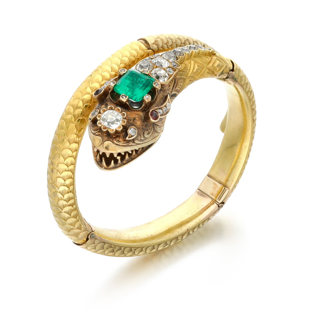View full screen - View 1 of Lot 2. Emerald, garnet and diamond bangle, 1860s.
