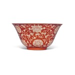 A coral-ground reverse-decorated 'lotus' bowl, Seal mark and period of Qianlong