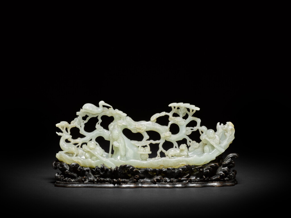 View full screen - View 1 of Lot 16. A rare pale celadon jade 'immortals' group, Qing dynasty, 18th century | 清十八世紀 青白玉雕仙人乘槎擺件.