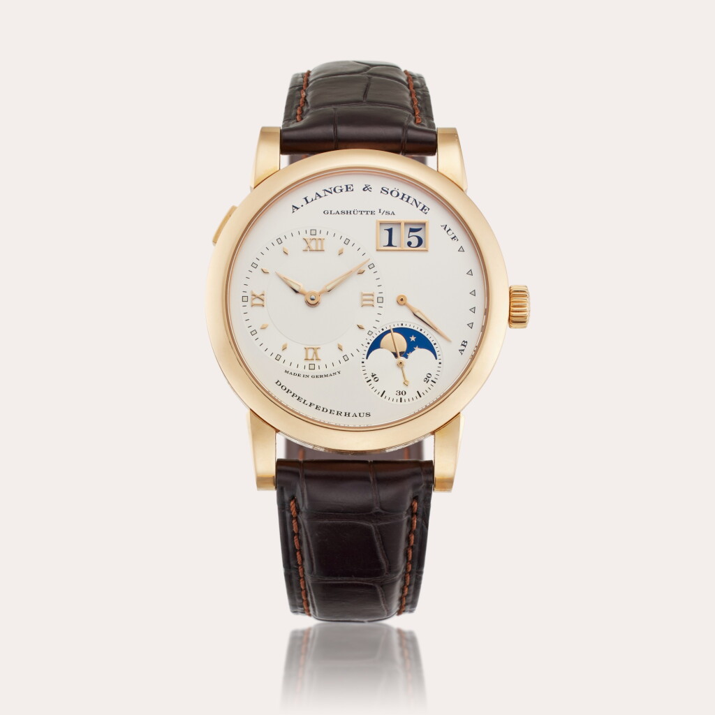 View full screen - View 1 of Lot 370. Reference 109.032 Lange 1 Moonphase | A pink gold wristwatch with moon phases, digital date display, and power reserve indication, Circa 2011.