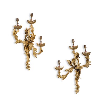 View full screen - View 1 of Lot 80. A pair of Louis XV style gilt-bronze three-light wall appliques, 19th century.