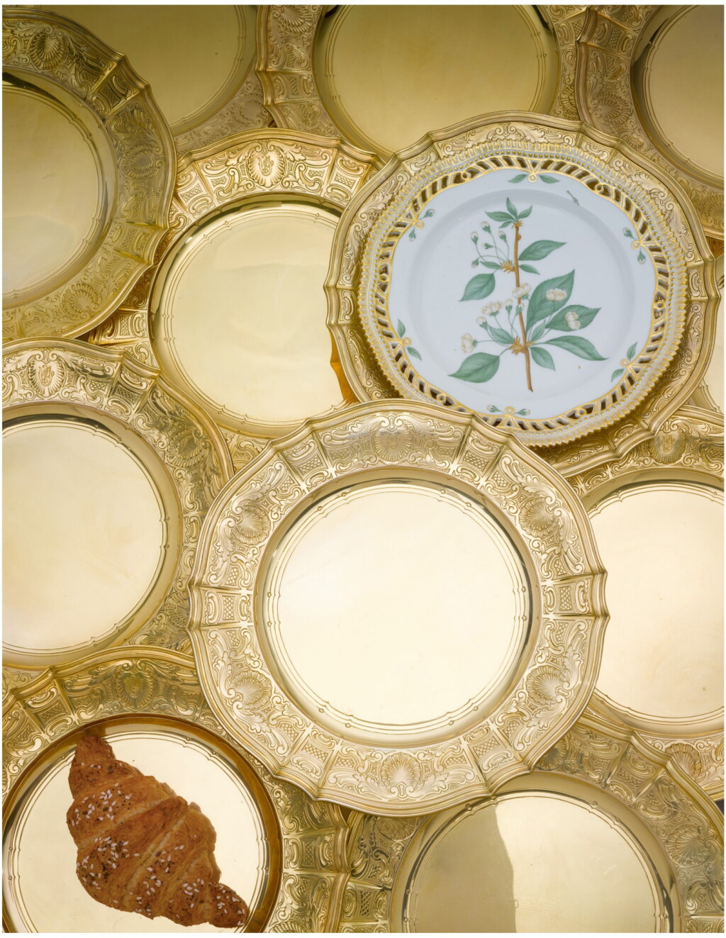 View full screen - View 1 of Lot 82. A SET OF SIXTEEN AMERICAN SILVER-GILT PLACE PLATES, TIFFANY & CO., NEW YORK, CIRCA 1910.