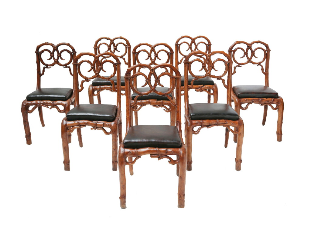View full screen - View 1 of Lot 86. A SUITE OF EIGHT WALNUT RUSTIC CHAIRS, FRENCH OR ENGLISH, 19TH CENTURY, FROM THE COLLECTION OF PIERRE BALMAIN | SUITE DE HUIT CHAISES EN NOYER SCULPTÉ À DÉCOR NATURALISTE, FRANCE OU ANGLETERRE, XIXE SIÈCLE, PROVENANT DE LA COLLECTION DE PIERRE BALMAIN.