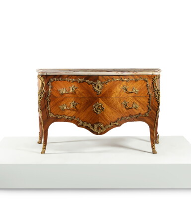 View full screen - View 1 of Lot 67. A Louis XV gilt-bronze mounted tulipwood and satiné veneered commode, stamped by Léonard Boudin, circa 1765.
