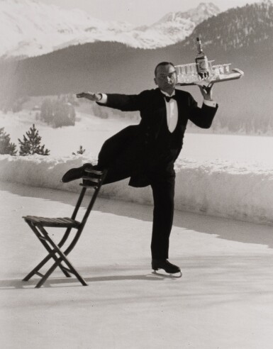 View full screen - View 1 of Lot 591. Headwaiter Rene Breguet Brings Aperitifs to Guests at the Skating Rink of the Grand Hotel, St. Moritz.