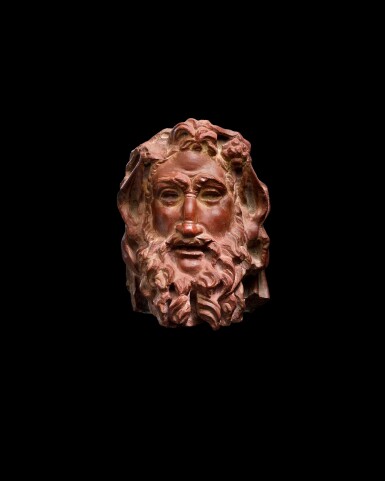 View full screen - View 1 of Lot 175. A Rosso Antico Marble Herm Head of a Satyr, circa 2nd Century A.D..