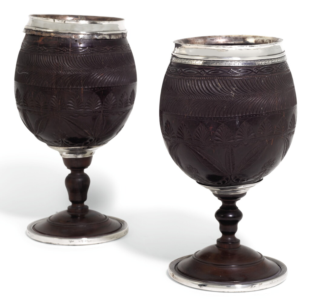 View full screen - View 1 of Lot 144. A PAIR OF GEORGE III SILVER MOUNTED CARVED COCONUT CUPS, THE MOUNTS UNMARKED, CIRCA 1790.