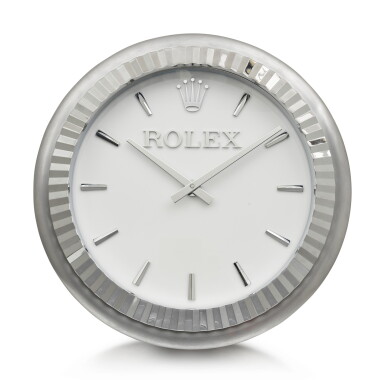 View full screen - View 1 of Lot 199. INDUCTA MANUFACTURE FOR ROLEX | A METALWORK WALL CLOCK, CIRCA 2010.