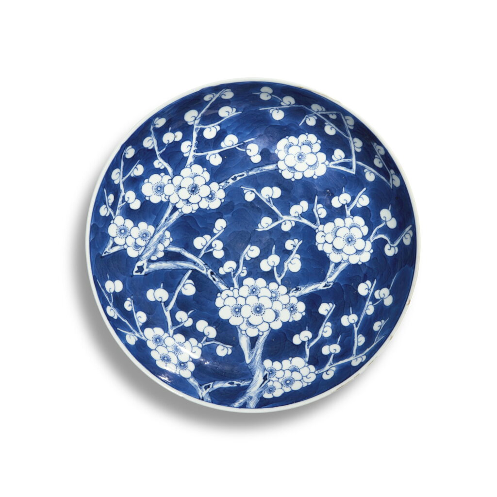 View full screen - View 1 of Lot 636. A blue and white 'prunus and cracked ice' dish, Qing dynasty, 19th century | 清十九世紀 青花冰梅紋盤.