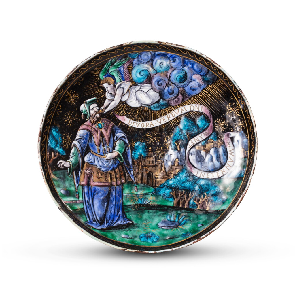 View full screen - View 1 of Lot 107. A Limoges painted enamel Tazza with an Angel feeding a prophet, probably Isaiah, Attributed to Colin Nouailher (c.1514-1571), Circa 1530-1550.