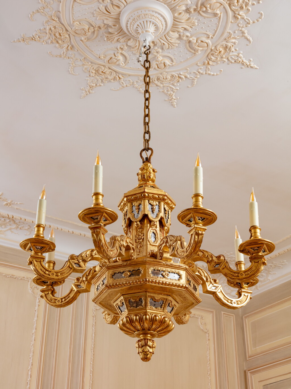 View full screen - View 1 of Lot 66. A Louis XIV giltwood and mirror plaques eight-light chandelier, circa 1700 (reglit) | Lustre à huit bras de lumières en bois redoré et plaques de miroir d'époque Louis XIV, vers 1700.
