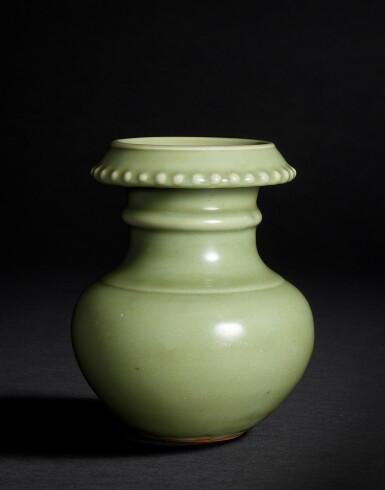 View full screen - View 1 of Lot 807. A very rare Longquan celadon pomegranate jar, shiliuzun, Ming dynasty, Hongwu - Yongle period | 明洪武至永樂 龍泉青釉小石榴尊 .