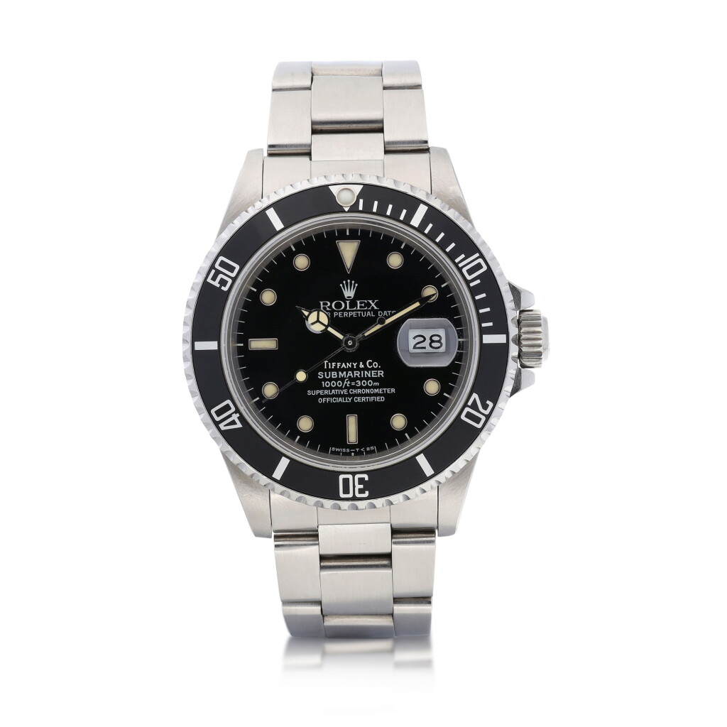 View full screen - View 1 of Lot 8015. Rolex | Submariner, Reference 168000, A stainless steel wristwatch with date and bracelet, Retailed by Tiffany & Co., Circa 1988 | 勞力士 | Submariner 型號168000 精鋼鏈帶腕錶,備日期顯示,由Tiffany & Co.發行,約1988年製.