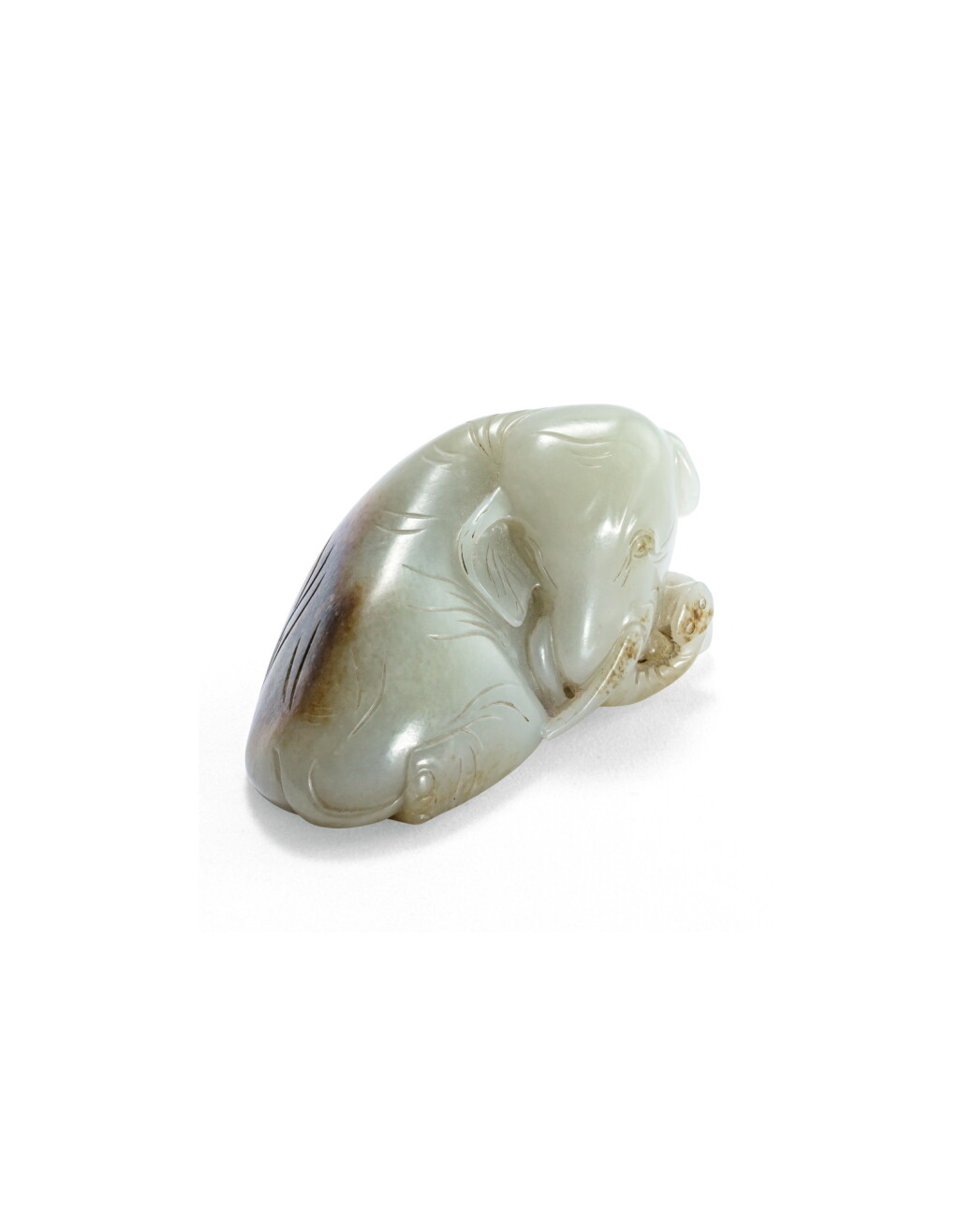 View full screen - View 1 of Lot 214. Statuette d'éléphant en jade céladon XXE siècle | 二十世紀 青白玉臥象擺件 | A celadon jade recumbent elephant, 20th century .