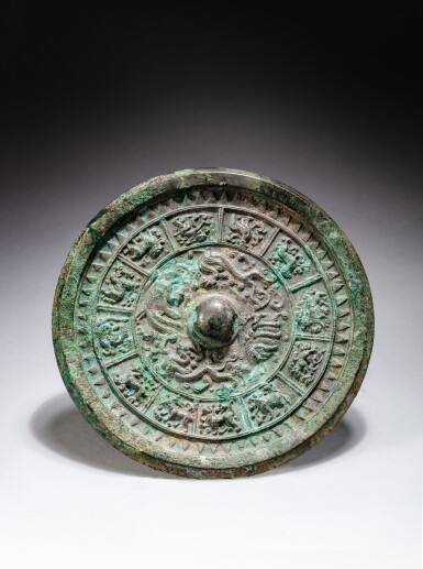 View full screen - View 1 of Lot 42. A silvery bronze 'zodiac' mirror, Tang dynasty | 唐 銅鎏銀十二生肖紋鏡.