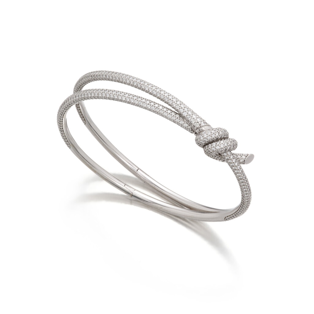 View full screen - View 1 of Lot 437. White Gold and Diamond 'Tiffany Knot' Bangle-Bracelet .