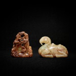 A yellow jade 'camel' pendant and a yellowish-celadon and russet jade 'deer and crane boulder' pendants, 17th century 十七世紀 黃玉駱駝珮 及 青黃玉帶皮鶴鹿同春山子珮