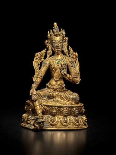View full screen - View 1 of Lot 406. A gilt-copper alloy figure of Syamatara, Tibet, 16th / 17th century | 西藏 十六 / 十七世紀 銅鎏金嵌寳綠度母坐像.